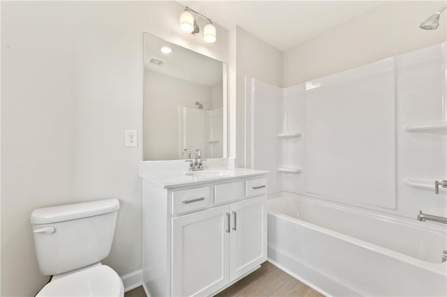 1987 Deco Dr, Kennesaw, GA 30144 - bathroom featuring vanity, shower / tub combination, and wood finished floors