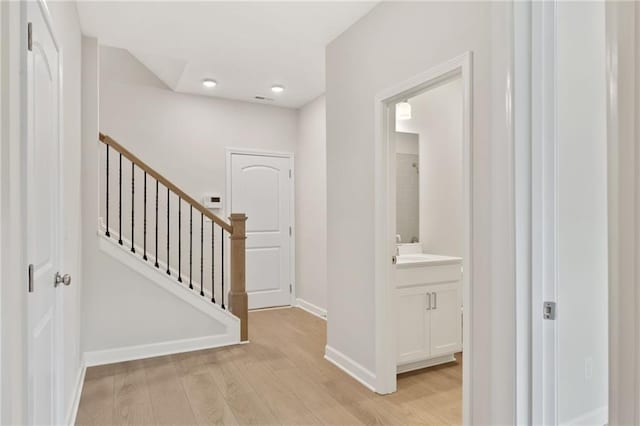 1987 Deco Dr, Kennesaw, GA 30144 - hallway featuring light wood finished floors and stairway