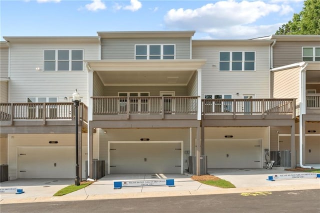 1987 Deco Dr, Kennesaw, GA 30144 - back of house with a garage and driveway