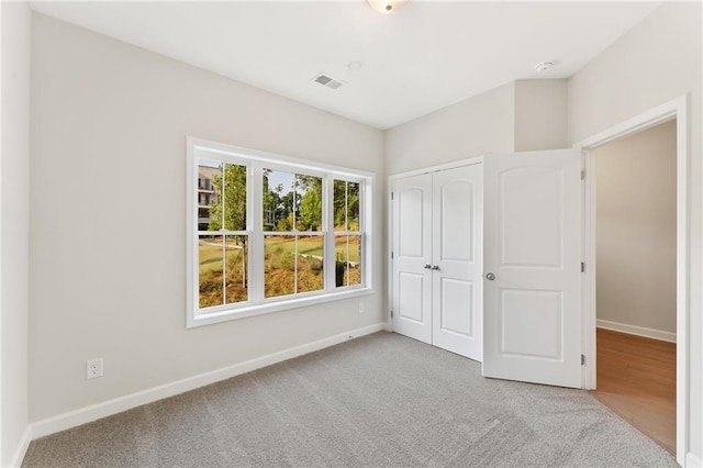 1987 Deco Dr, Kennesaw, GA 30144 - unfurnished bedroom featuring carpet and a closet