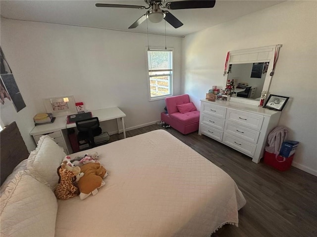 bedroom featuring dark wood-style floors, baseboards, and a ceiling fan