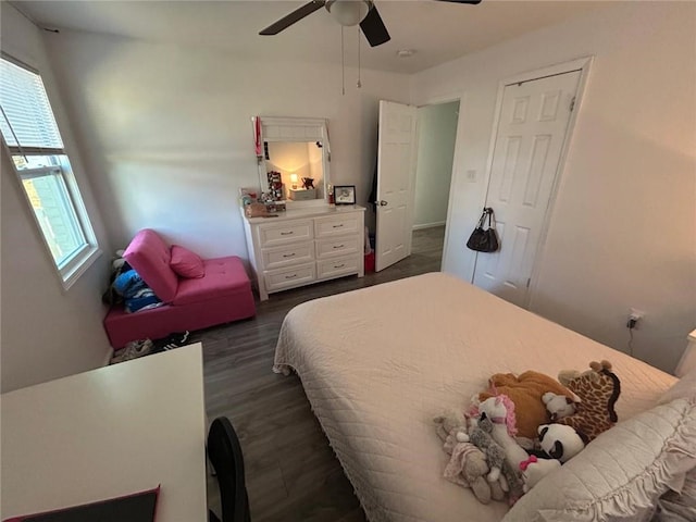 bedroom featuring dark wood-type flooring and ceiling fan