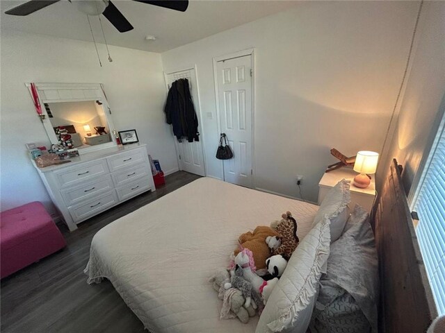 bedroom with ceiling fan and dark wood-style flooring