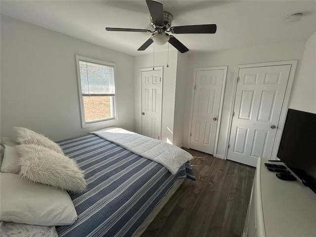 bedroom with ceiling fan and dark wood-type flooring