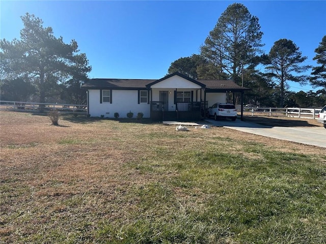 view of front of house with an attached garage, fence, driveway, and a front lawn