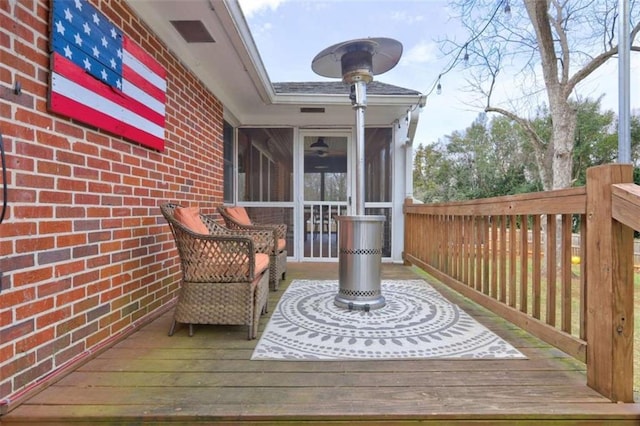 deck with a sunroom