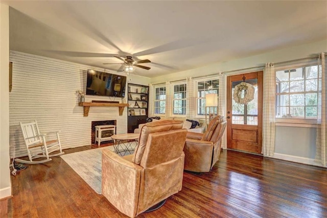 living room featuring dark hardwood / wood-style floors and ceiling fan