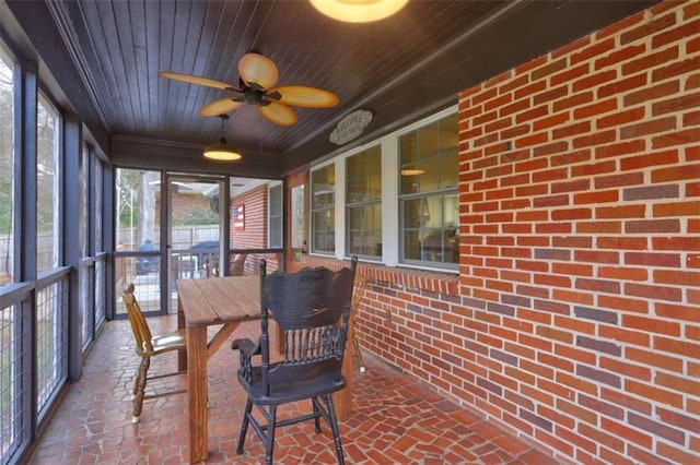 sunroom / solarium with wood ceiling and ceiling fan