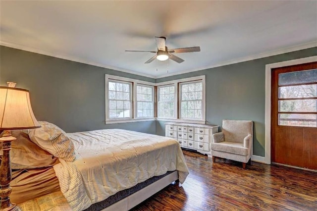 bedroom featuring ceiling fan, ornamental molding, dark hardwood / wood-style flooring, and multiple windows