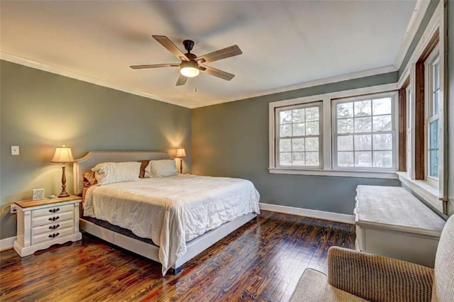 bedroom featuring crown molding, dark hardwood / wood-style floors, and ceiling fan