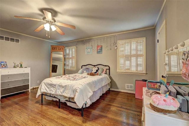 bedroom with ceiling fan, ornamental molding, and dark hardwood / wood-style floors