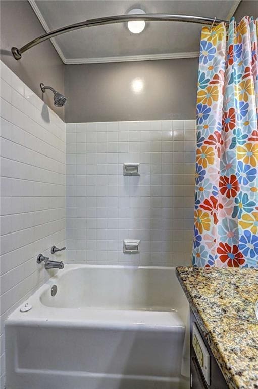 bathroom featuring crown molding, vanity, and shower / bath combo