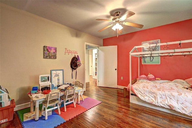 bedroom featuring ceiling fan and dark hardwood / wood-style flooring