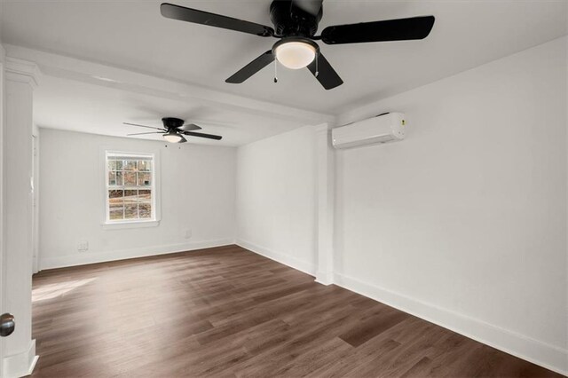 empty room featuring dark hardwood / wood-style floors, ceiling fan, and an AC wall unit