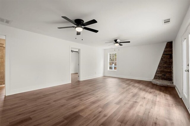 unfurnished room featuring dark hardwood / wood-style floors and ceiling fan