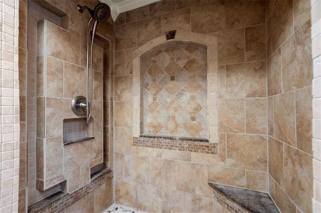 bathroom with tiled shower