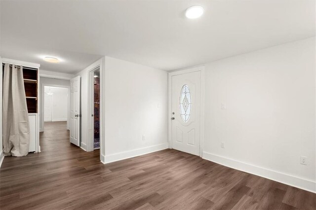 entryway with dark hardwood / wood-style flooring