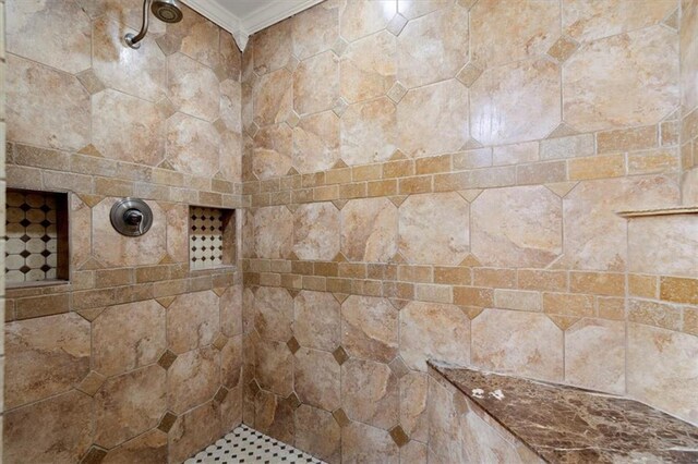 room details featuring a tile shower and crown molding