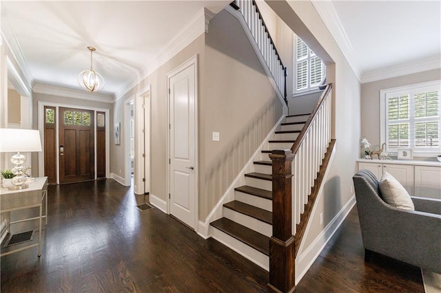 2370 Burch Cir, Brookhaven, GA 30319 - foyer entrance featuring stairway, a chandelier, ornamental molding, wood finished floors, and baseboards