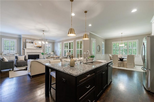 2370 Burch Cir, Brookhaven, GA 30319 - kitchen featuring a sink, stainless steel appliances, dark wood-style flooring, dark cabinets, and crown molding