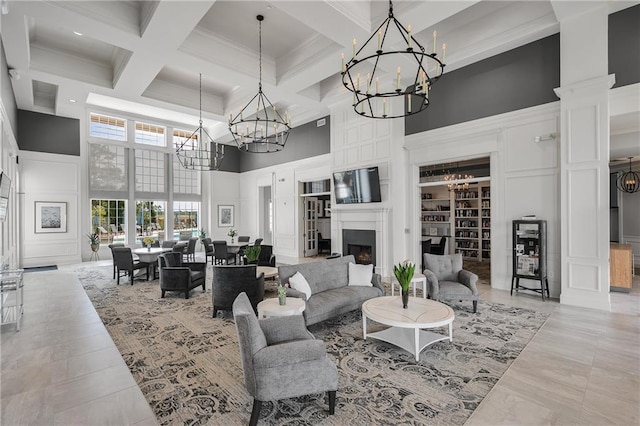 2808 Turnwater St, Hoschton, GA 30548 - living room featuring a decorative wall, a towering ceiling, a chandelier, coffered ceiling, and beam ceiling