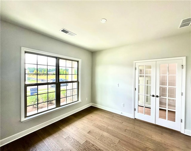 2808 Turnwater St, Hoschton, GA 30548 - empty room featuring french doors and wood finished floors