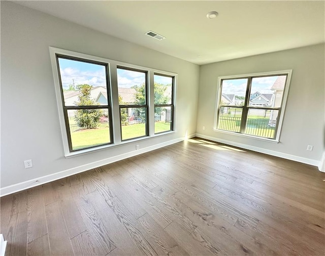 2808 Turnwater St, Hoschton, GA 30548 - spare room with baseboards and dark wood-type flooring