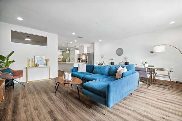 24 Becker Pl NW, Atlanta, GA 30307 - living room with wood finished floors, recessed lighting, and baseboards