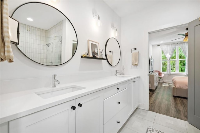 24 Becker Pl NW, Atlanta, GA 30307 - ensuite bathroom featuring double vanity, a tile shower, and baseboards
