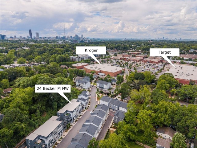 24 Becker Pl NW, Atlanta, GA 30307 - drone / aerial view of city skyline and a tree filled landscape