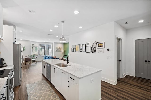 24 Becker Pl NW, Atlanta, GA 30307 - kitchen featuring a sink, stainless steel appliances, dark wood finished floors, an island with sink, and recessed lighting