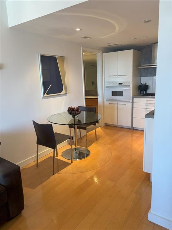 dining area featuring light wood-type flooring