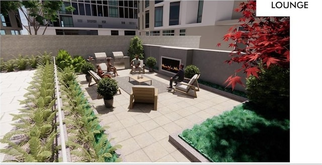 view of patio / terrace with an outdoor fireplace and an outdoor kitchen