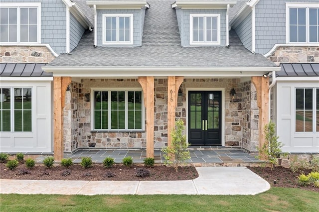 615 Claxton Ln, Milton, GA 30004 - entrance to property featuring stone siding, roof with shingles, a porch, and a standing seam roof