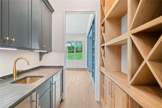 615 Claxton Ln, Milton, GA 30004 - kitchen featuring a sink, light wood-type flooring, and gray cabinets