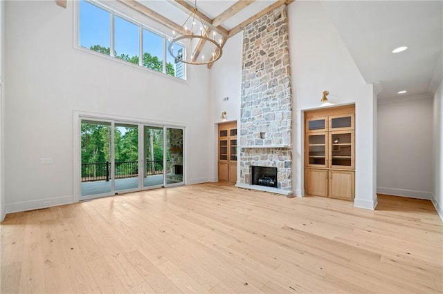 615 Claxton Ln, Milton, GA 30004 - unfurnished living room featuring high vaulted ceiling, a chandelier, hardwood / wood-style floors, baseboards, and beamed ceiling
