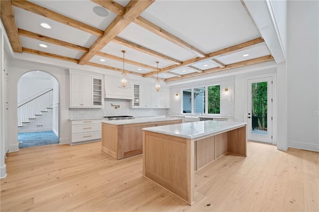 615 Claxton Ln, Milton, GA 30004 - kitchen with a large island, coffered ceiling, light wood-style flooring, light countertops, and beam ceiling