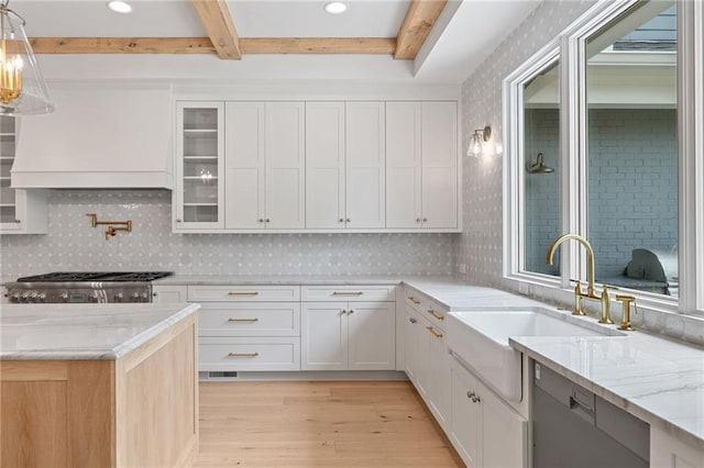 615 Claxton Ln, Milton, GA 30004 - kitchen featuring beamed ceiling, light wood finished floors, a sink, white cabinetry, and custom range hood