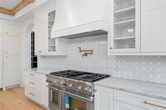 615 Claxton Ln, Milton, GA 30004 - kitchen featuring double oven range, premium range hood, and white cabinets