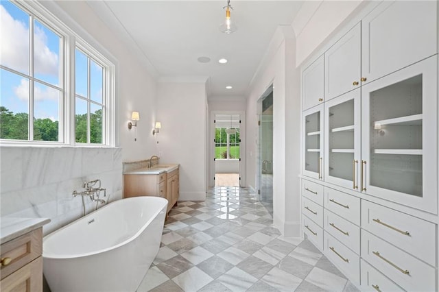 615 Claxton Ln, Milton, GA 30004 - full bath with a freestanding bath, a stall shower, vanity, baseboards, and ornamental molding