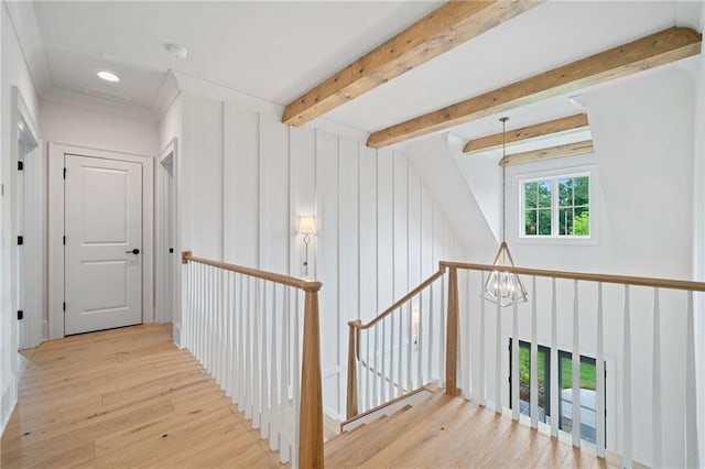 615 Claxton Ln, Milton, GA 30004 - hallway with an upstairs landing, wood finished floors, beamed ceiling, and a chandelier