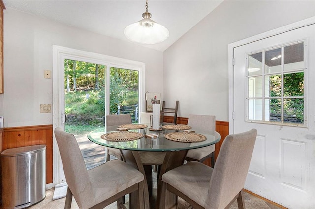 dining space with lofted ceiling