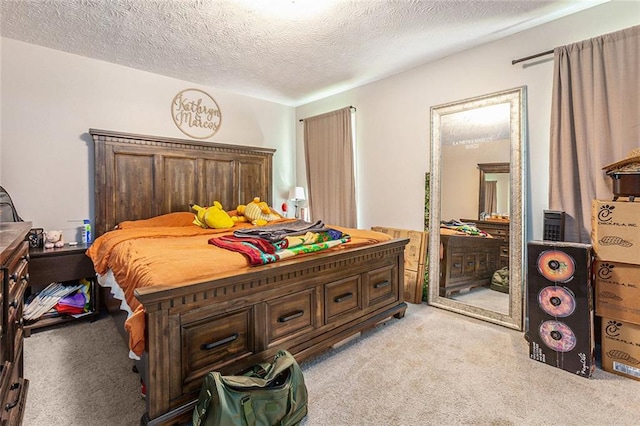 carpeted bedroom with a textured ceiling