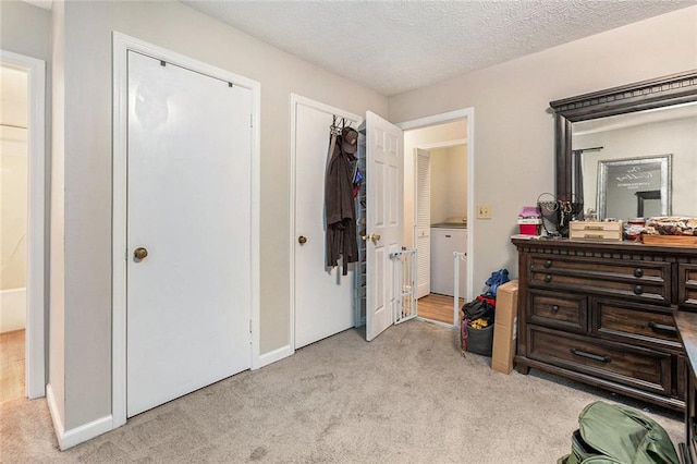 carpeted bedroom featuring a textured ceiling