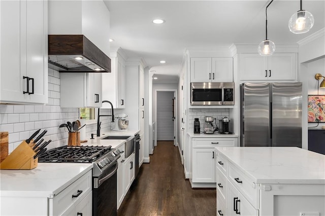 1055 Delmont Ter, Roswell, GA 30075 - kitchen featuring appliances with stainless steel finishes, wall chimney range hood, a sink, decorative backsplash, and white cabinets
