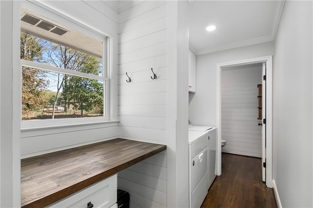 1055 Delmont Ter, Roswell, GA 30075 - laundry room with cabinet space, plenty of natural light, separate washer and dryer, dark wood-style flooring, and crown molding