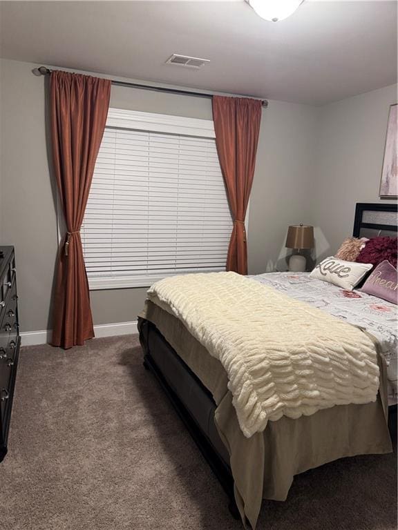 2709 Ratby Ln NE, Conyers, GA 30013 - bedroom featuring dark colored carpet and baseboards