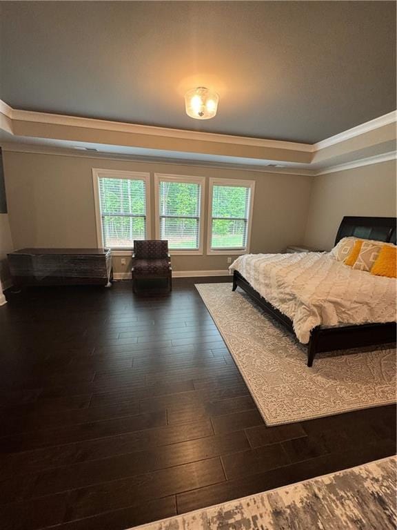 2709 Ratby Ln NE, Conyers, GA 30013 - bedroom with ornamental molding, a raised ceiling, and dark wood finished floors