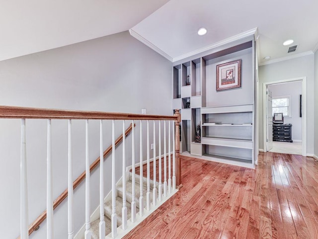 corridor featuring crown molding, wood finished floors, recessed lighting, an upstairs landing, and baseboards