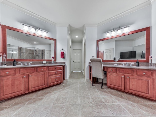 bathroom with crown molding, a stall shower, tile patterned floors, and two vanities